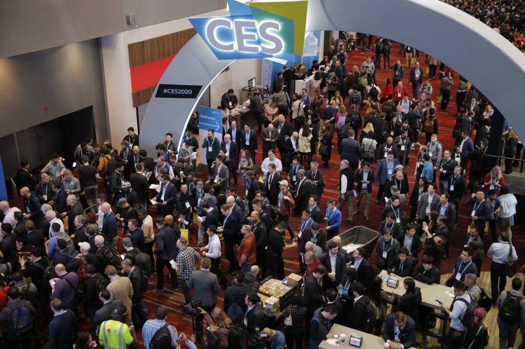Packed crowd beneath the CES archway