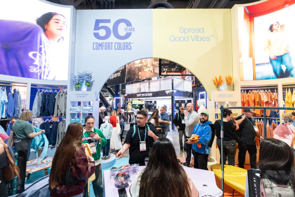 Apparel booth with visitors at Impressions Expo