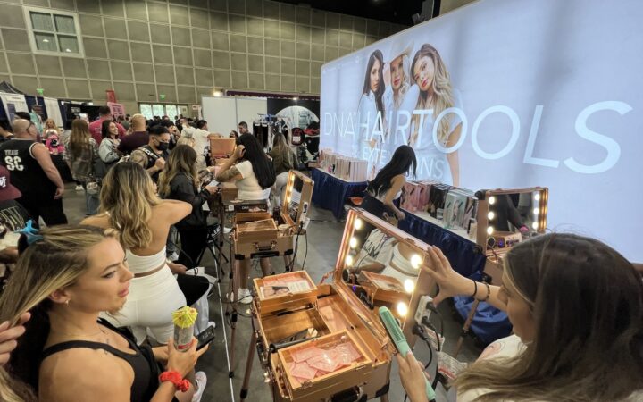 Attendees at an exhibitor booth