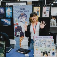 Artist booth with prints at LightBox Expo