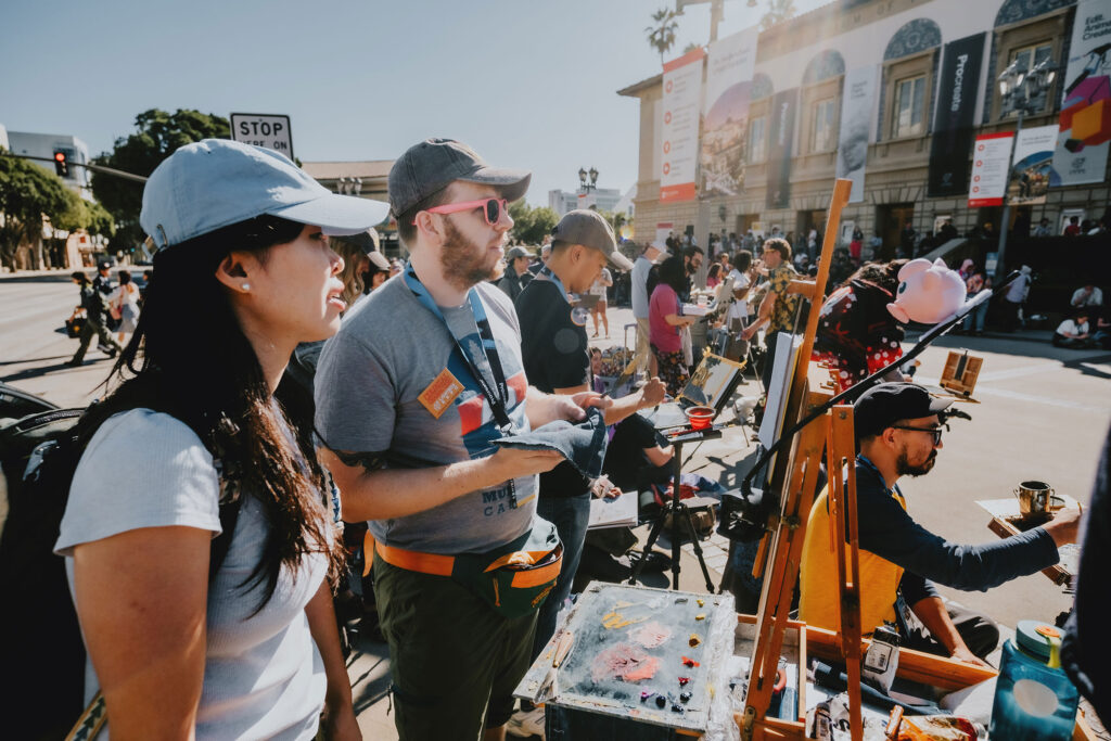 Attendees browsing artist tables