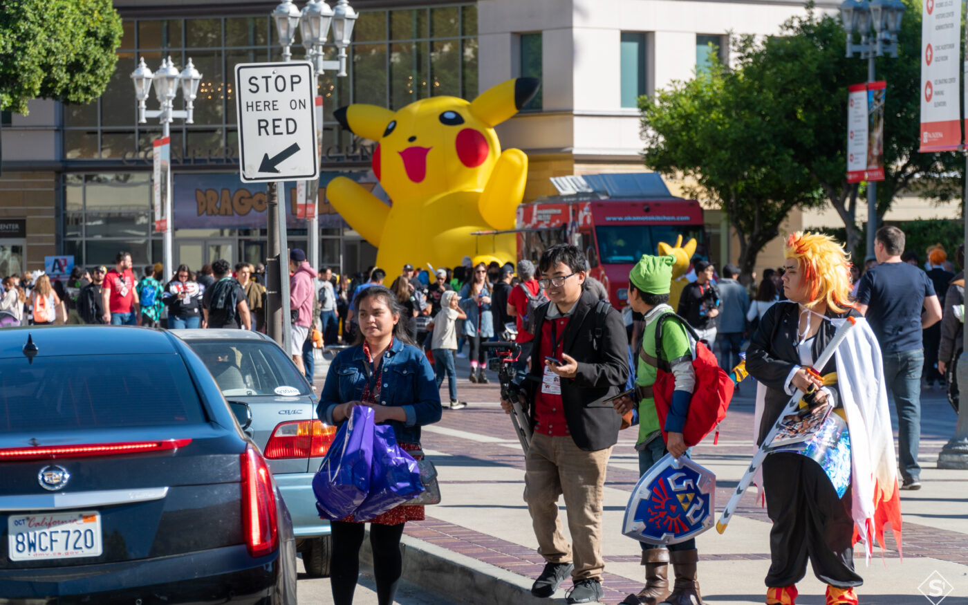 Costumed attendees outside the venue