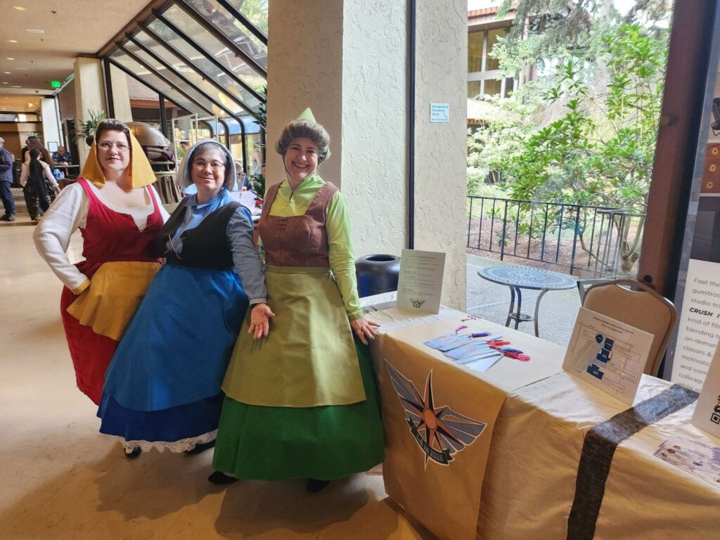 Costumed attendees at a fan table