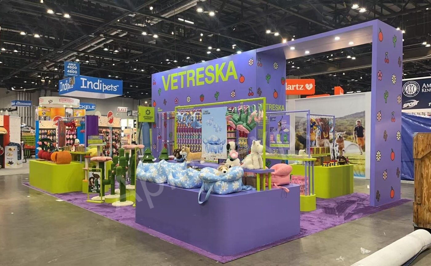 A colorful pet brand booth ready for product discovery at SUPERZOO
