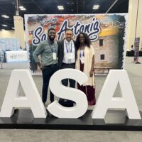 Attendees at the ASA meeting sign