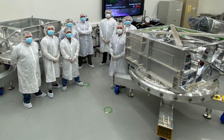 NASA/JPL engineers with Europa Clipper vault hardware in a clean room