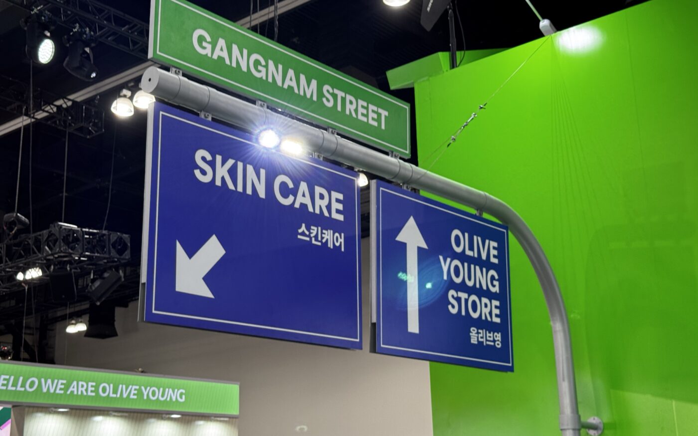 Gangnam Street and Olive Young Store directional signs at KCON LA 2026