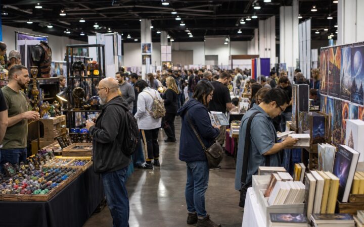 Science-fiction convention marketplace with independent dealers, artists and attendees