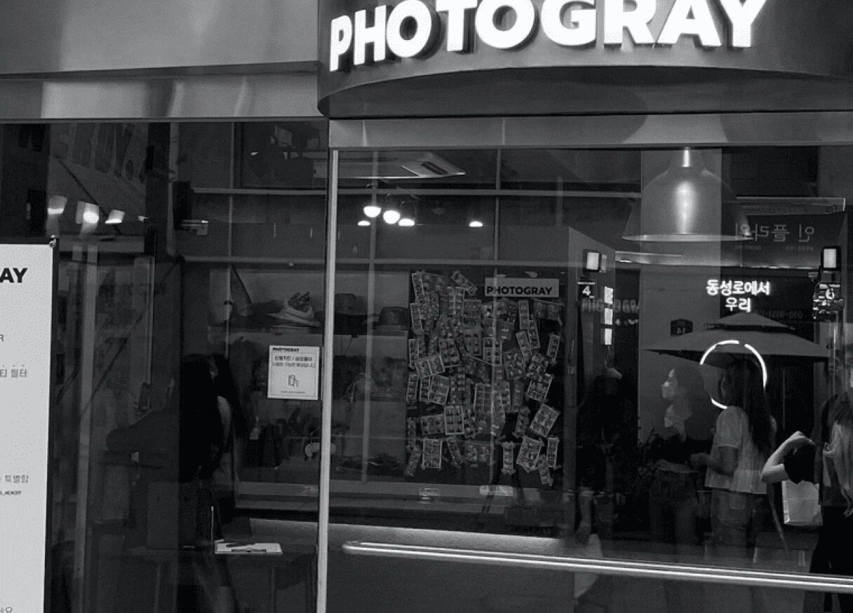 PHOTOGRAY self-photo studio storefront with photo strips displayed inside