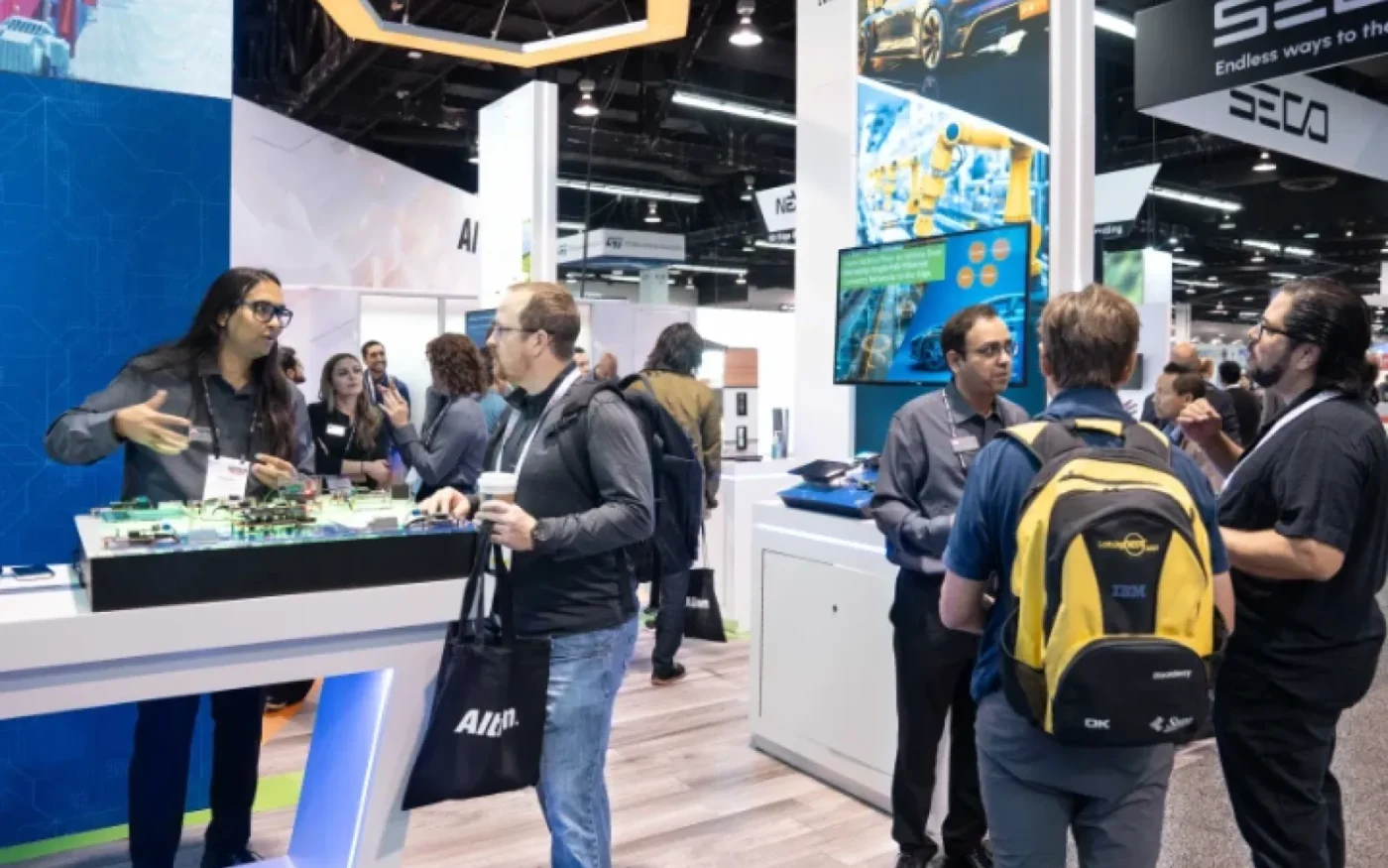 Attendees discuss embedded technology on the embedded world North America show floor