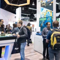 Attendees discuss embedded technology on the embedded world North America show floor
