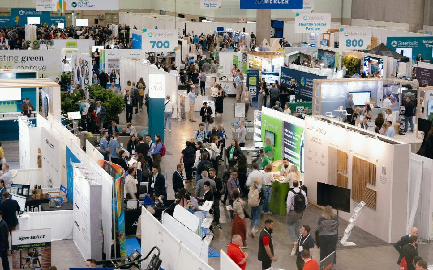 Greenbuild expo hall with sustainability exhibitors and attendees